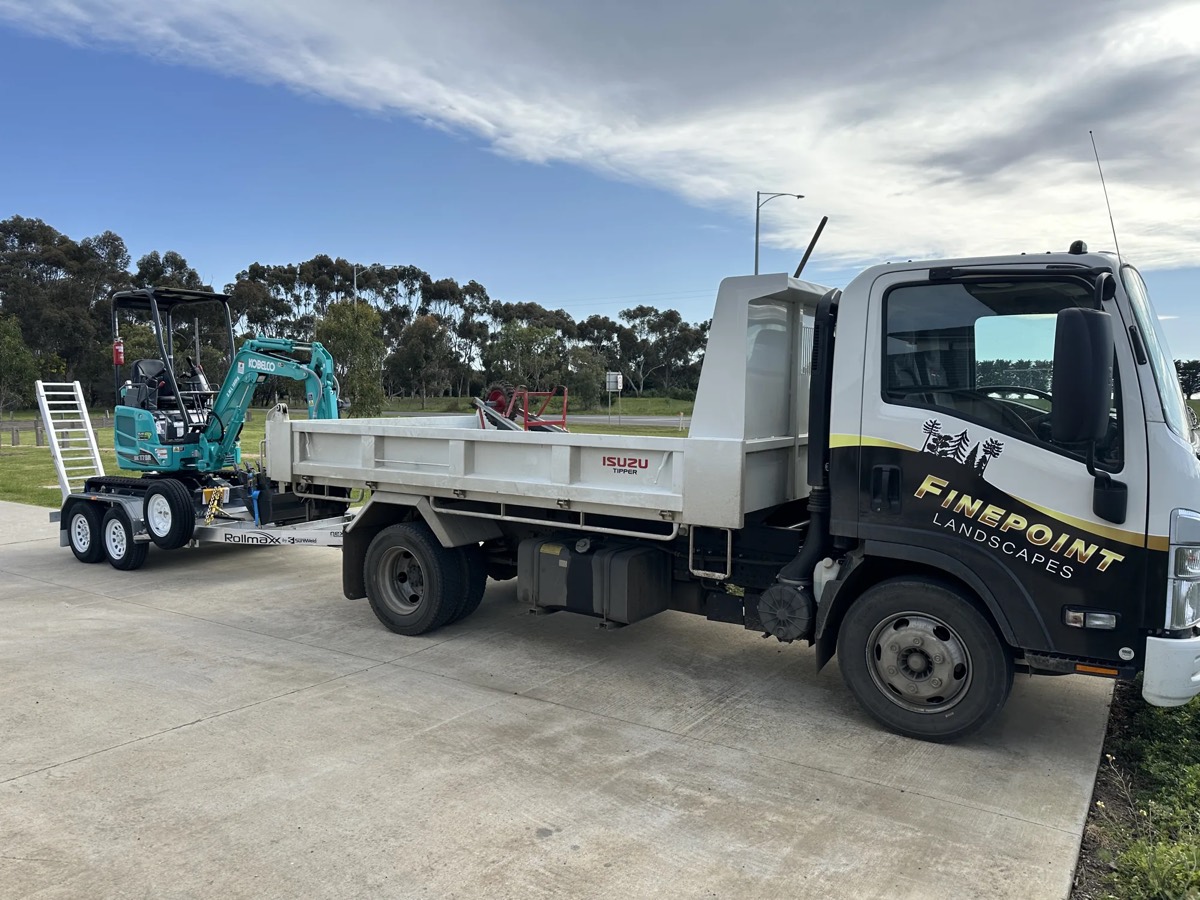 Finepoint Landscapes tipper truck and excavator