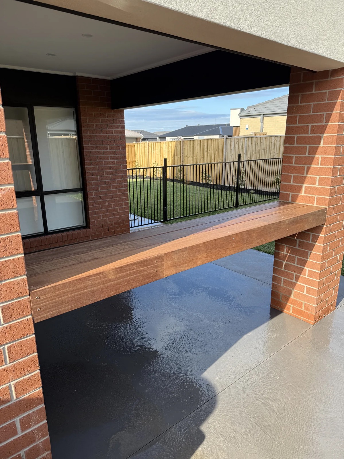 Floating timber bench seat in alfresco area