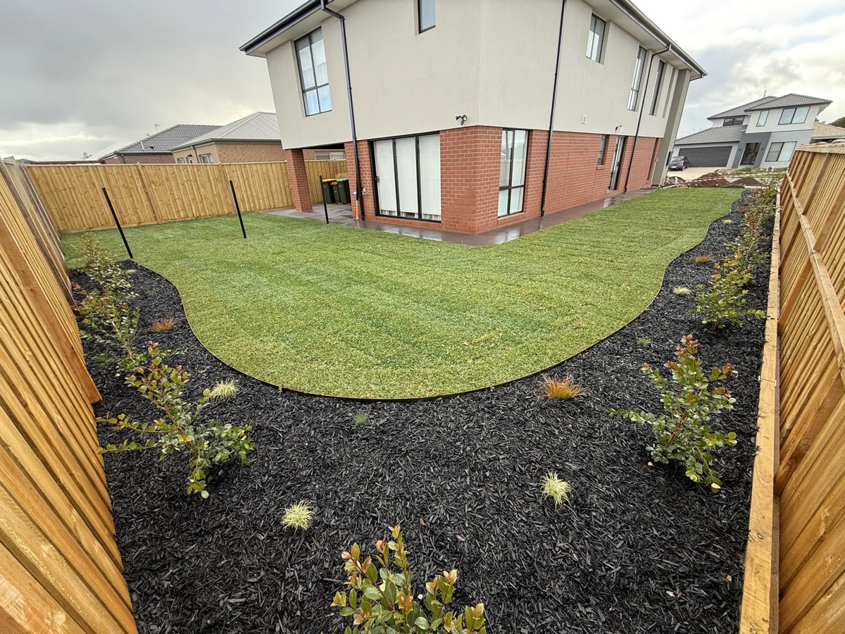Complete landscape build with new lawn and curved garden beds