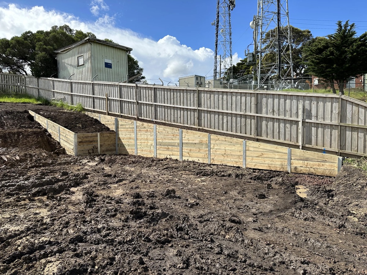 Timber sleeper retaining wall on a sloped block